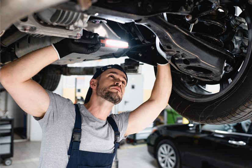 mechanic under car